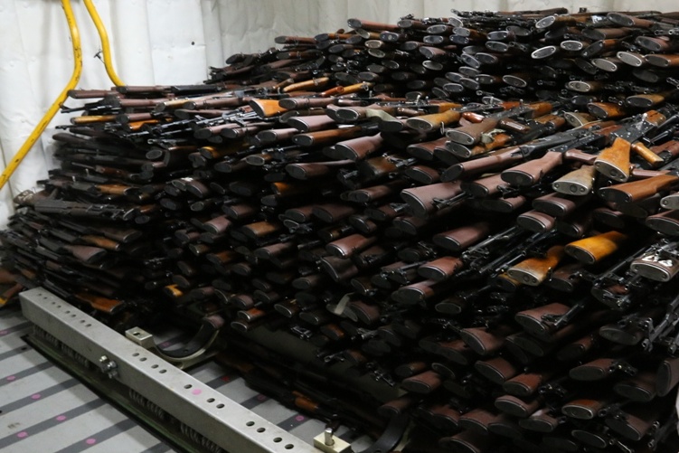 Piles of automatic weapons stacked up like cordwood