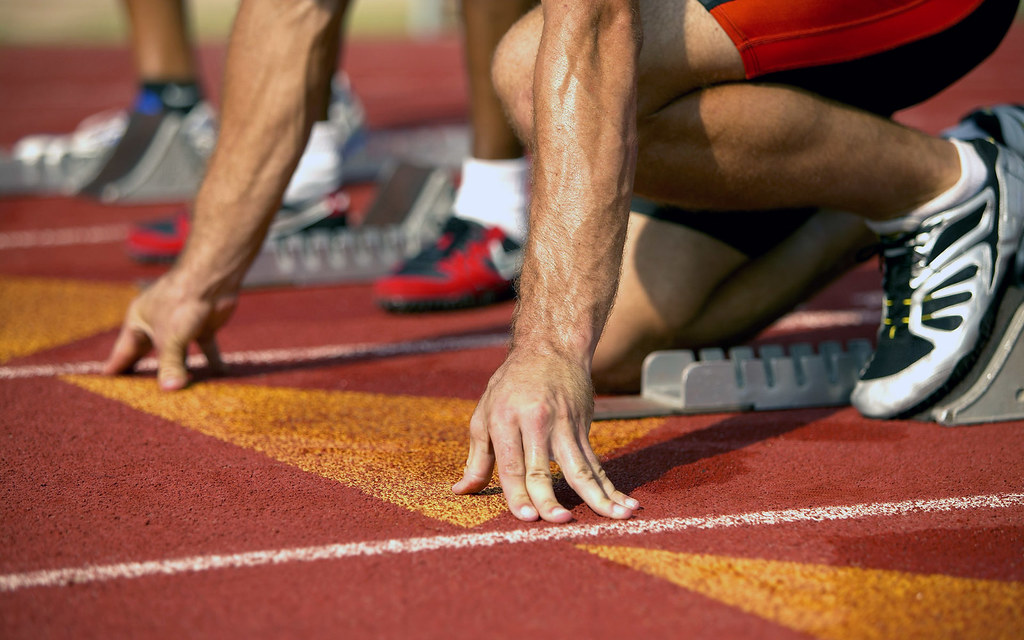 Athlete in starting blocks at beginning of a sprint