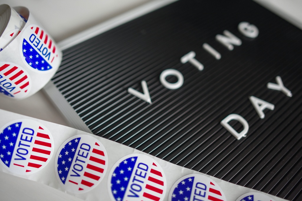 "I Voted" stickers with a signboard reading "Voting Day"